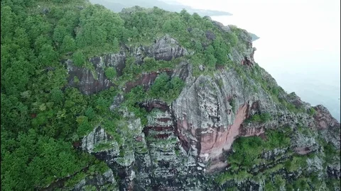 Flight over rock in Mauritius Stock Footage 113476693