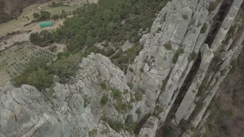 Flight over rocks cross climber 05 Stock Footage 148369722