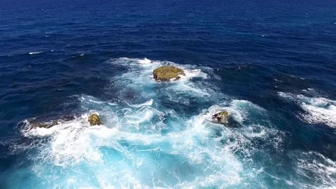 Flight over a rocks in the ocean Stock Footage