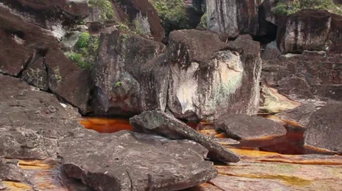 Flight over rocks, with red water Stock Footage 38741022