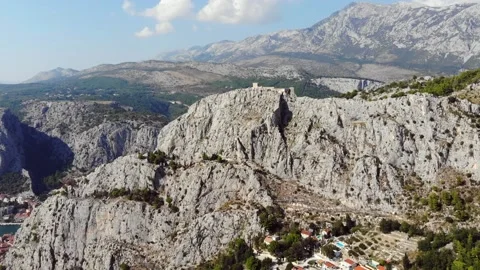 Flight Over The Rocky Mountains With A Castle On Top Of The Ridge Stock Footage 167425323