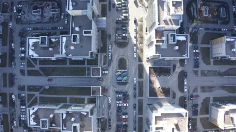 Flight over rooftops and carriageways of the city block Stock Footage 112263725