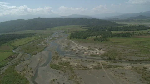 Flight over rural area with river and plantation Stock Footage 554258