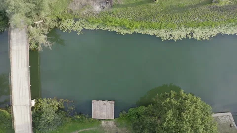 Flight over a rural bridge on a small river Stockbeeldmateriaal 138529726