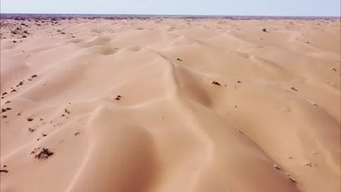 Flight over the sand dunes in the desert on a sunny day. Stock Footage 165382396