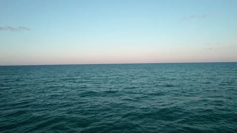 Flight over the sea. The endless horizon below us, only the blue depths. Stock Footage 160249495