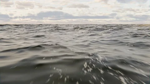 Flight over sea, ocean or big lake with clouds in sky Видео 167800909
