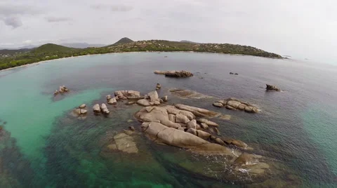 Flight over the sea with rocks and stones in water, Corsica. Aerial view. Vídeo Stock 47370668