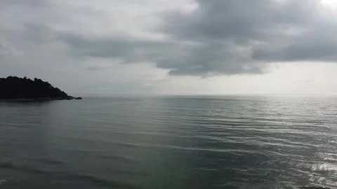 Flight over the sea with slight waves and cloudy sky Video stock 243979021