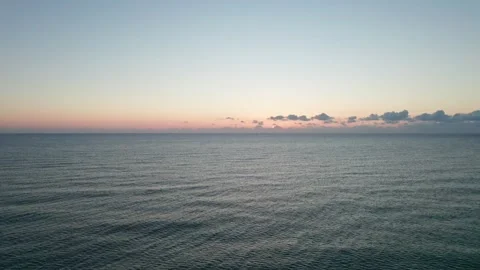 Flight over the sea from the sunrise. Stock Footage 222956575