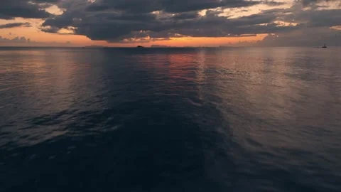 Flight over sea at sunset with transition to sky engulfed in flames. Fast flight Stock Footage 270416799