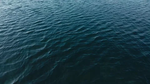 Flight over the sea surface by a beach Stock Footage 140229196