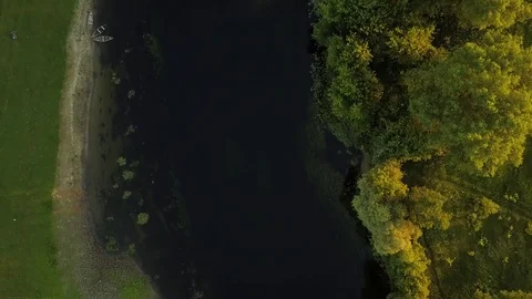 Flight over the Seim River, Ukraine surrounded by trees, view from the top - Stock Footage 76987612