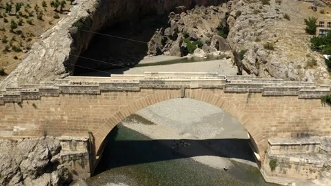 Flight over the severan bridge and over a river in Turkey. Stockbeeldmateriaal 153518677