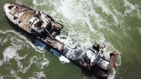 Flight over a ship wreck along skeleton coast in Namibia Stock Footage 148598854