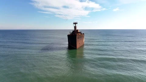 Flight over the shipwreck. A lone old ship wreck in the middle of the sea. Stock Footage 194670100
