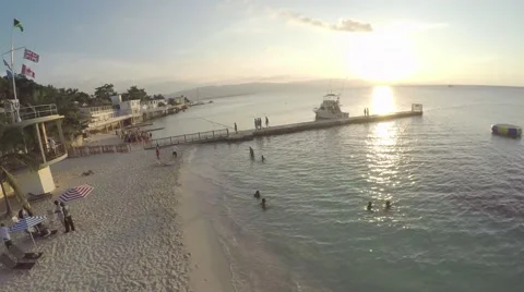 Flight over shore towards sunset in Jamaica Stock Footage 53064643