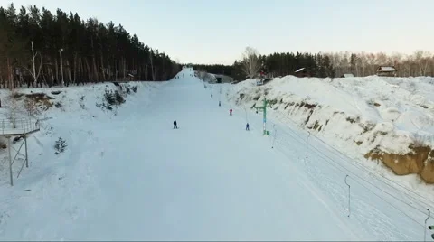 Flight over the ski lift. rope tow. snowboarder downhill Stock Footage 60762602