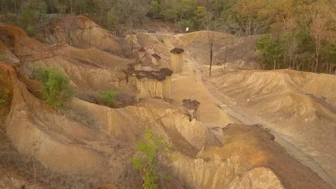 Flight over small canyons in Thailand Stock Footage