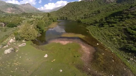 The flight over the small mountain lake Stock Footage 93782932