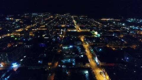 Flight over a small night city Stock Footage