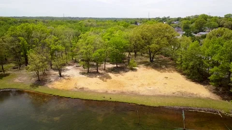 Flight over a small pond Stock Footage 130545618