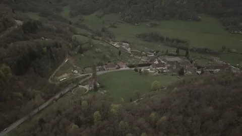 Flight over a small town on a cloudy spring 1080 ungraded Stock Footage 105953338