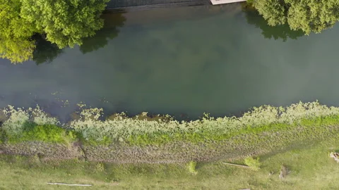 Flight over a small waterfall on a sunny day Stock Footage 138531789