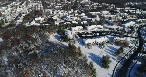 Flight over snow covered suburbs Stock-Footage 83796847