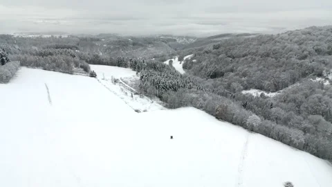 Flight over snow covered valley with city of Linz am Rhein appearing in distance Stock Footage 225272232