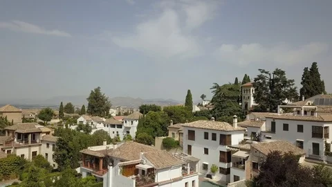 Flight over Spanish Rooftops and Gardens in Granada (Ungraded) Stock Footage 85868122