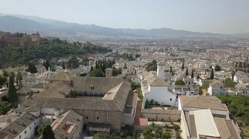 Flight over Spanish Rooftops and Gardens in Granada (Ungraded) Stock Footage 85868309