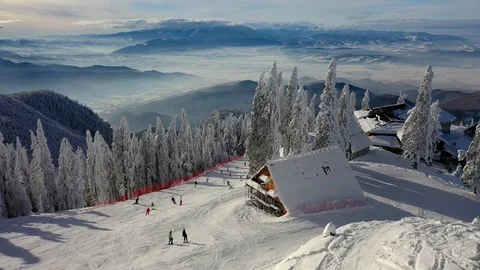 Flight over the spectacular ski slopes in the Carpathians mountains, Panorami Stock Footage 104883455