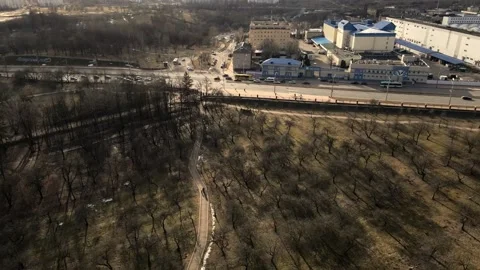 Flight over the spring city park. Walkways are visible. Patterns of park alleys. Stock Footage 150563466
