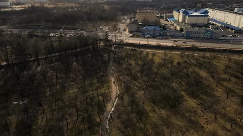 Flight over the spring city park. Walkways are visible. Patterns of park alleys. Stock Footage 150563687