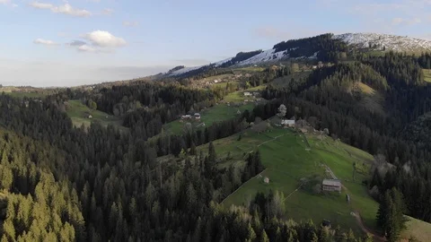  Flight over spring  mountain village with forest in sunset soft light. Stock Footage 119352282