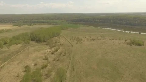 Flight over the spring valley and the river Stock Footage 69126117