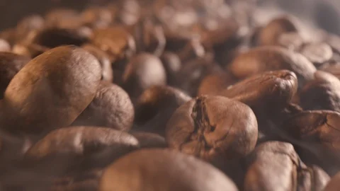 Flight over steaming roasted coffee beans in close-up Stock Footage 124066211