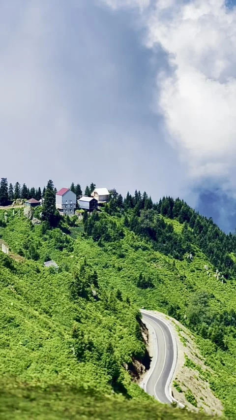 Flight over the summer mountains with mountain road serpentine, green meadows Stock Footage 304862144