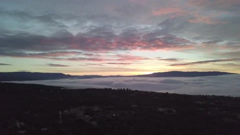Flight over sunrise sea of clouds south france 01 Stock Footage 148369952
