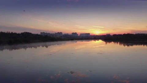 Flight over the surface of the lake on a summer morning. Stock Footage 204881247