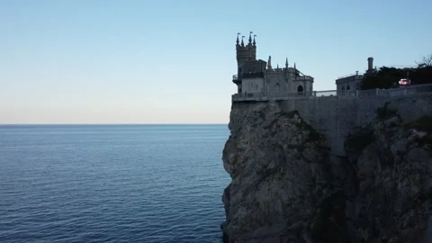 Flight over the Swallow's Nest castle and the Black Sea at sunset in Crimea. Stock-Footage 155451638