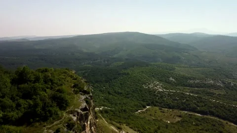 Flight over the top of the mountain and a bird's eye view of the mountains Stock Footage 160855102