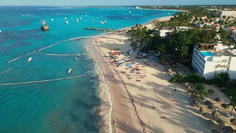 Flight over the tourist beach Los Corales Beach, Bavaro in Punta Cana Stock Footage 308334325