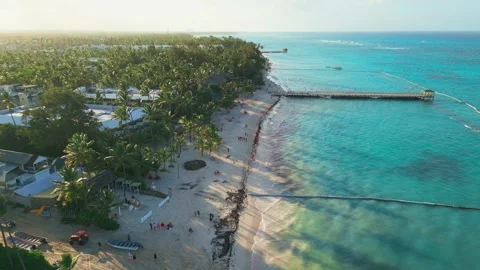 Flight over the tourist beach Los Corales Beach, Bavaro in Punta Cana Stock Footage 308334350