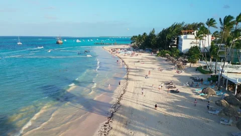Flight over the tourist beach Los Corales Beach, Bavaro in Punta Cana Stock Footage 308334415