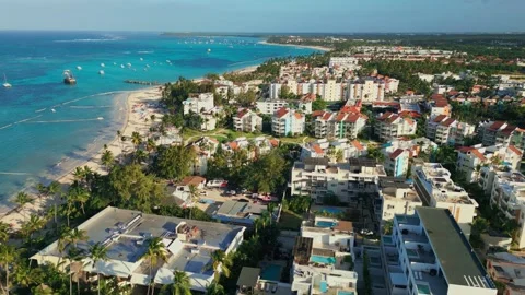 Flight over a tourist residence at sunset in Bavaro Punta Cana Stock Footage 308334619