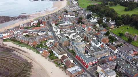 Flight over town North Berwick, Scotland,  landing footage and beach view 動画素材 139442236