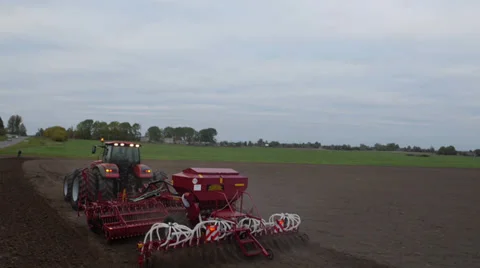 Flight over the tractor in the field stock footage, aerial view Stock Footage 37549862