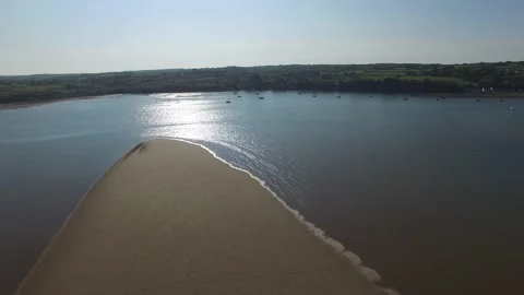 Flight over Traeth Coch / Red Wharf Bay, Anglesey, Wales, UK Stock Footage 234070454